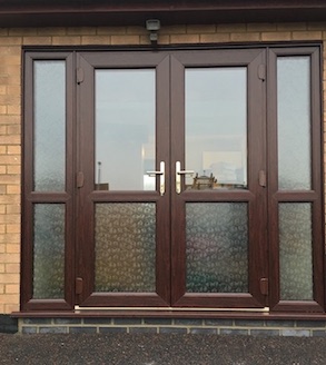 Brown double doors with side panels